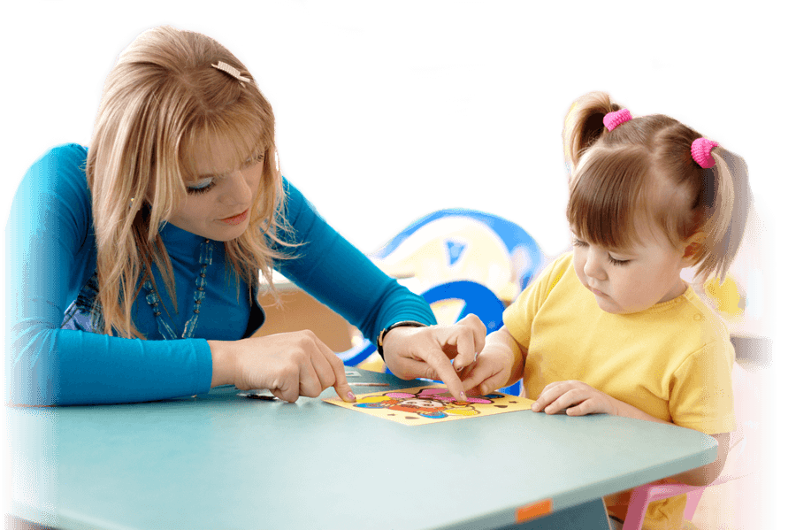 Image: Teacher assisting child